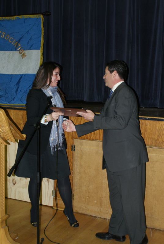 Dr. Elaine M. Chugranis presents the scholarship award to John Lappas for recipient Peter C Lappas