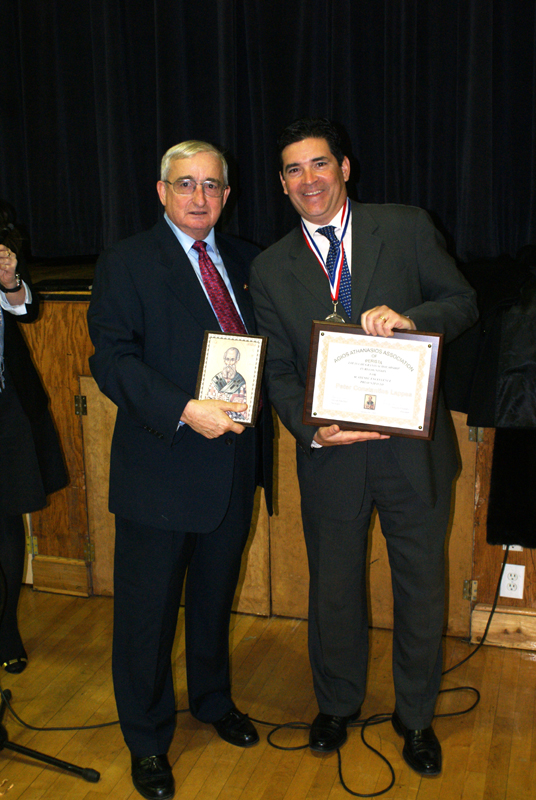 President Greg Chugranis with John Lappas displaying the scholarship award
